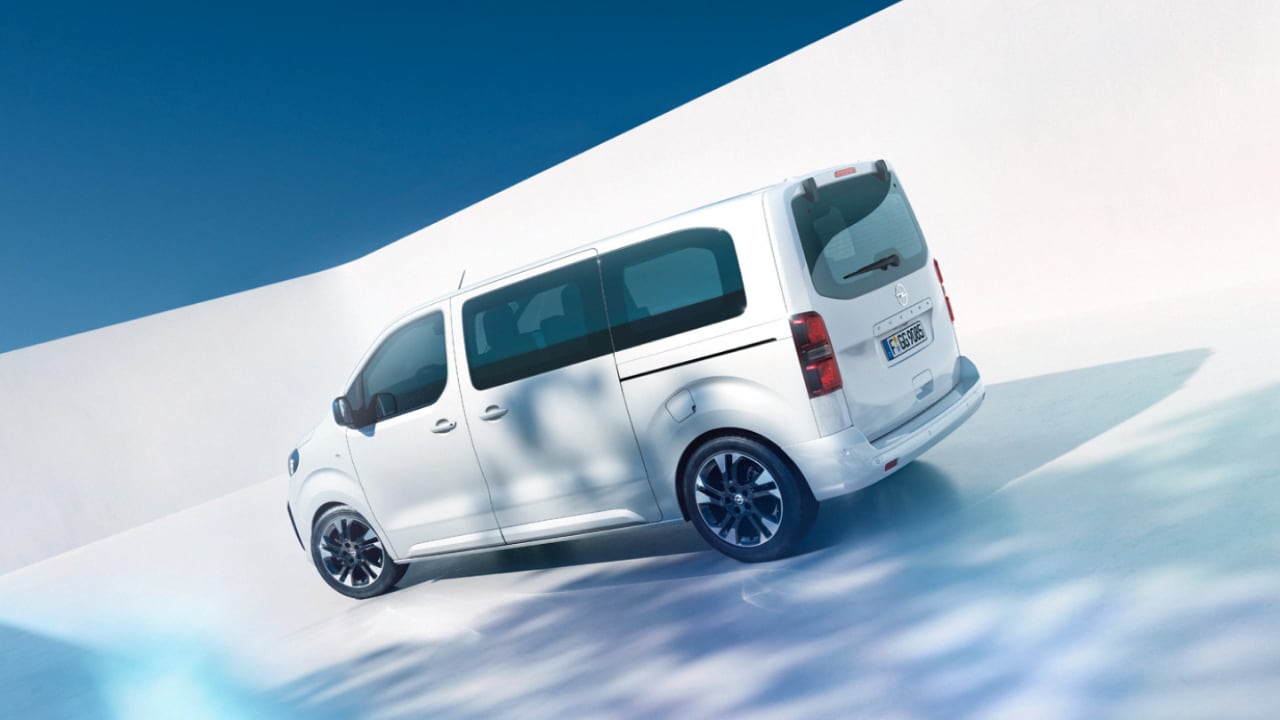  Man and boy with a white Opel Zafira  in the background